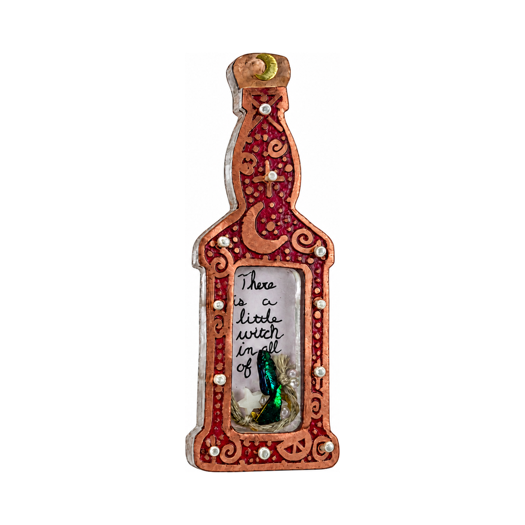 Red potion bottle pin shown from the left, showing its raised copper edge and dimensional window