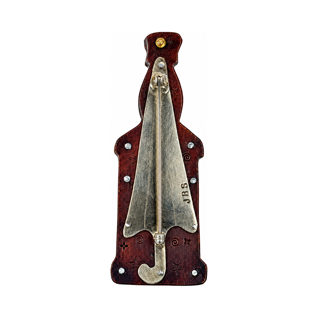 Back of the red potion bottle pin showing the brass pin clasp